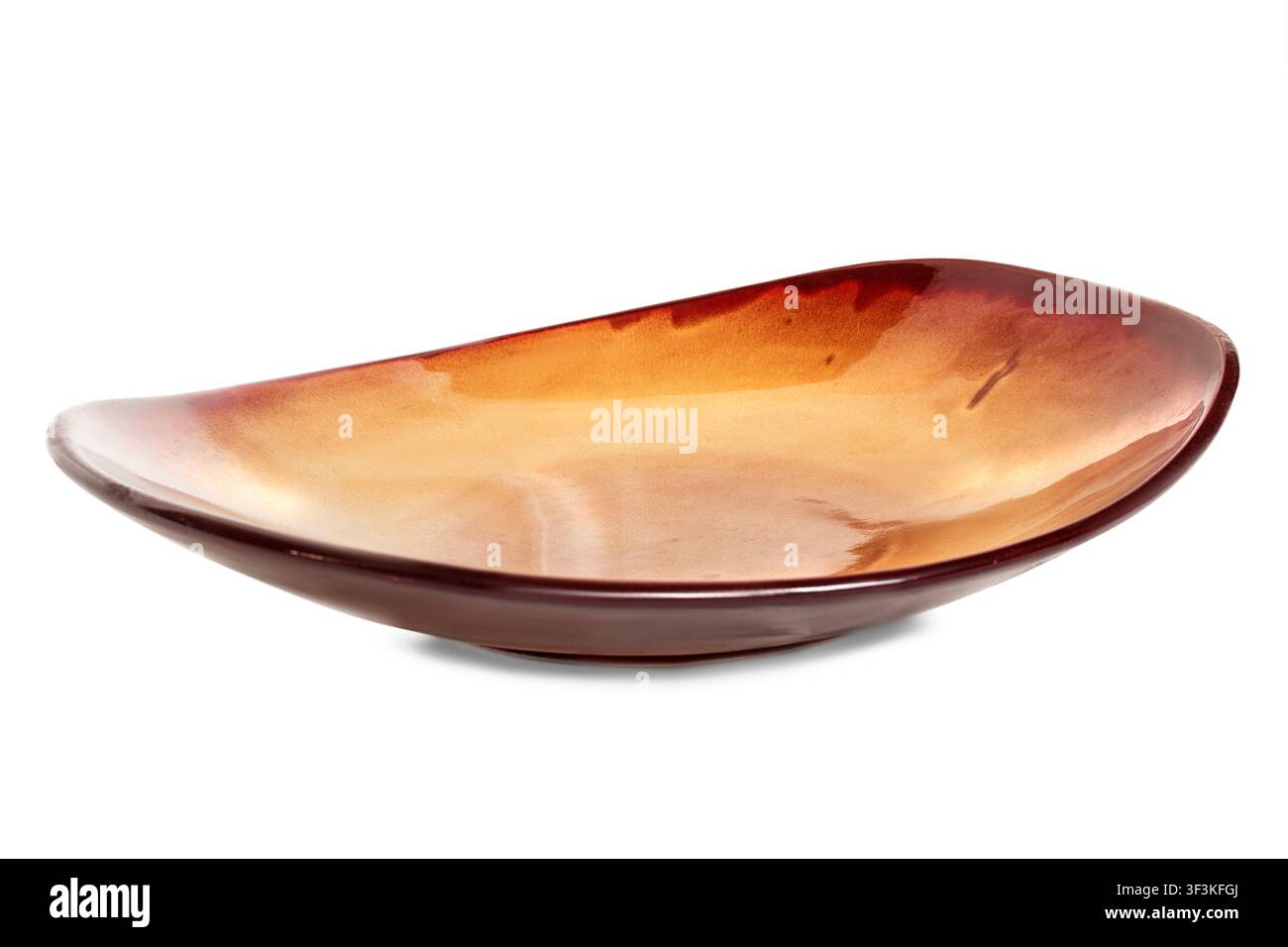 Brown ceramic empty large dish isolated on white background Stock Photo