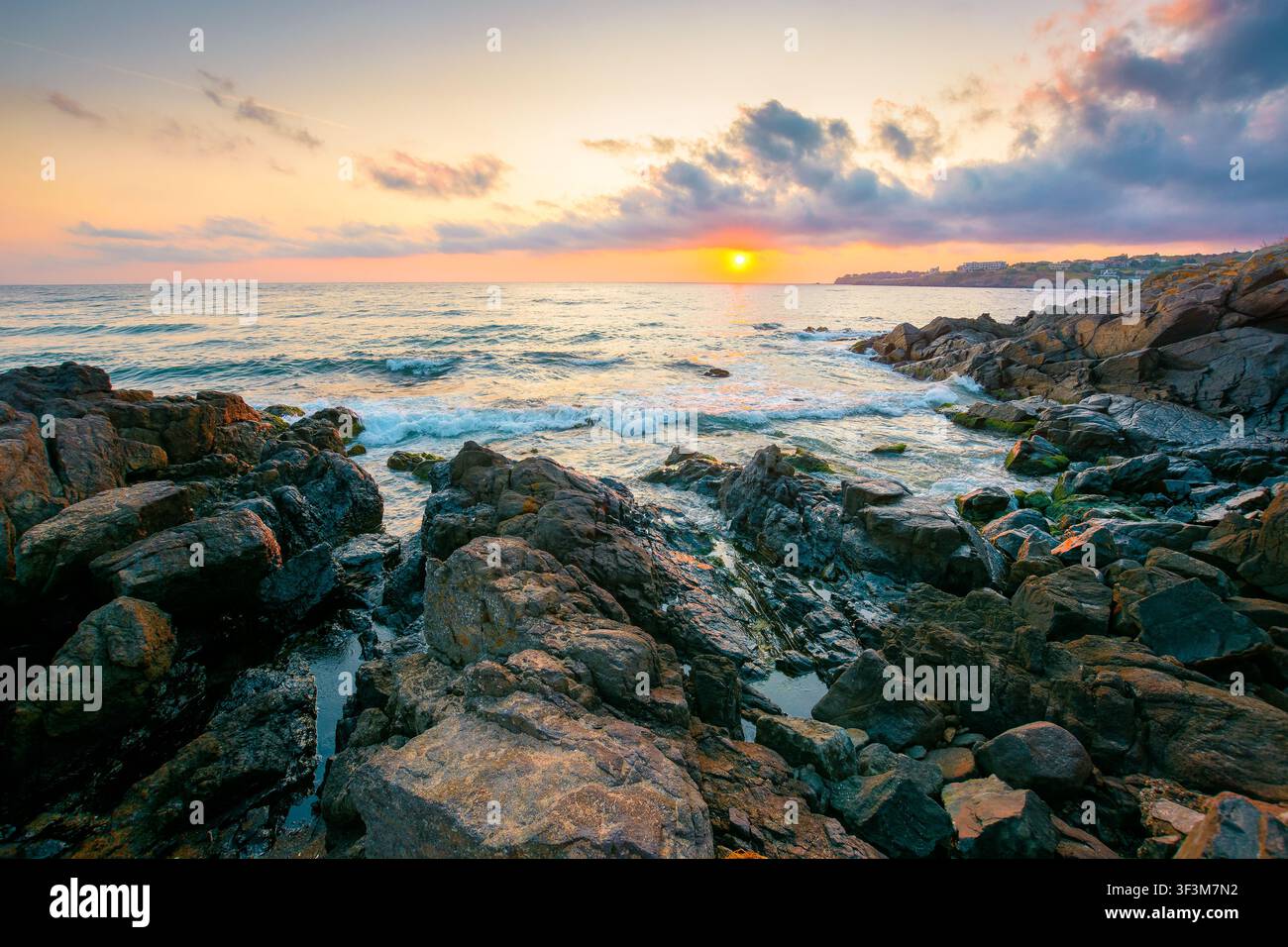 sea landscape at sunrise. rocky coast of bulgaria in summer. dramatic travel background with epic sky Stock Photo