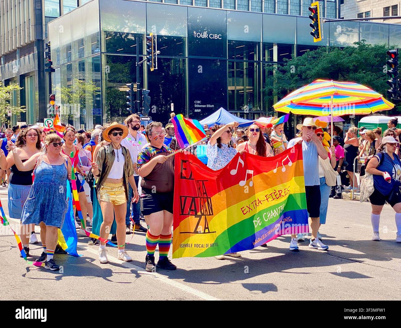 People celebrate during the Montreal Pride Parade in downtown Montreal, Quebec, Canada, in August, promoting diversity, equality, inclusion - Smartphone Captured Stock Image