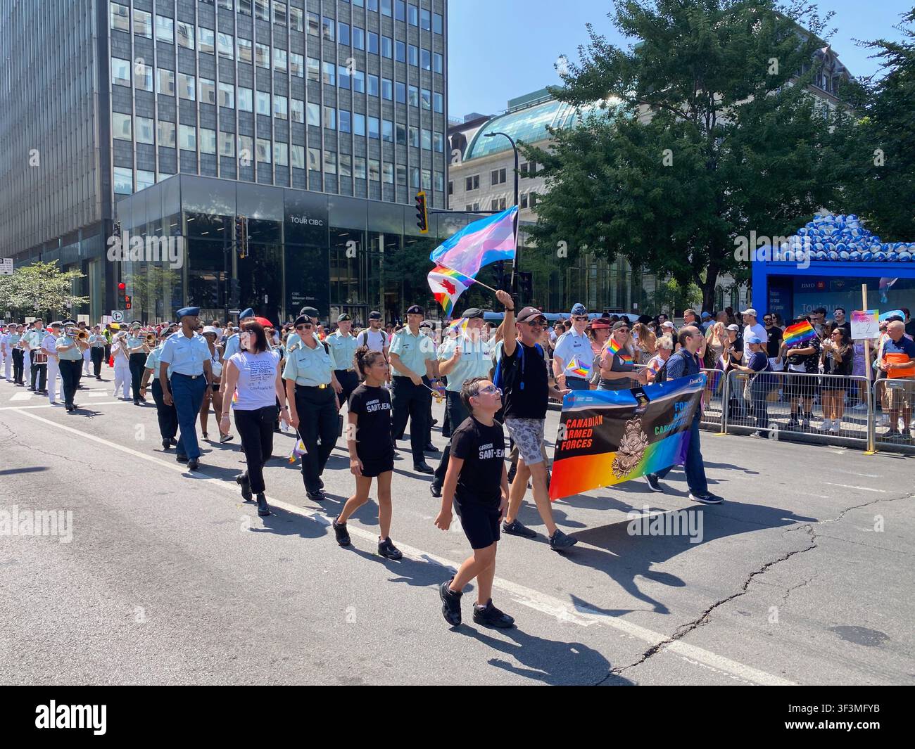 People celebrate during the Montreal Pride Parade in downtown Montreal, Quebec, Canada, in August, promoting diversity, equality, inclusion Stock Photo