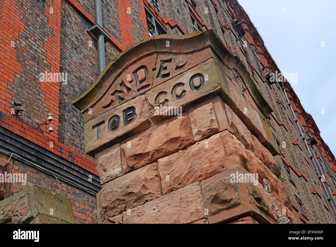 Historic Liverpool tobacco warehouse stone detail with carved Wade and Co lettering, Liverpool, England, UK. Stock Photo