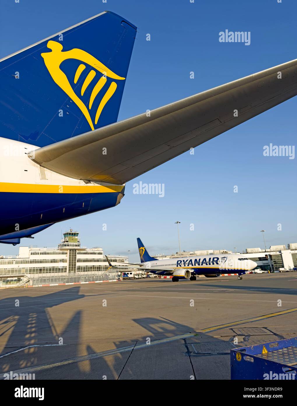Ryanair aircraft parked on the airport apron, with another Ryanair plane in the background, photographed in Europe. Stock Photo