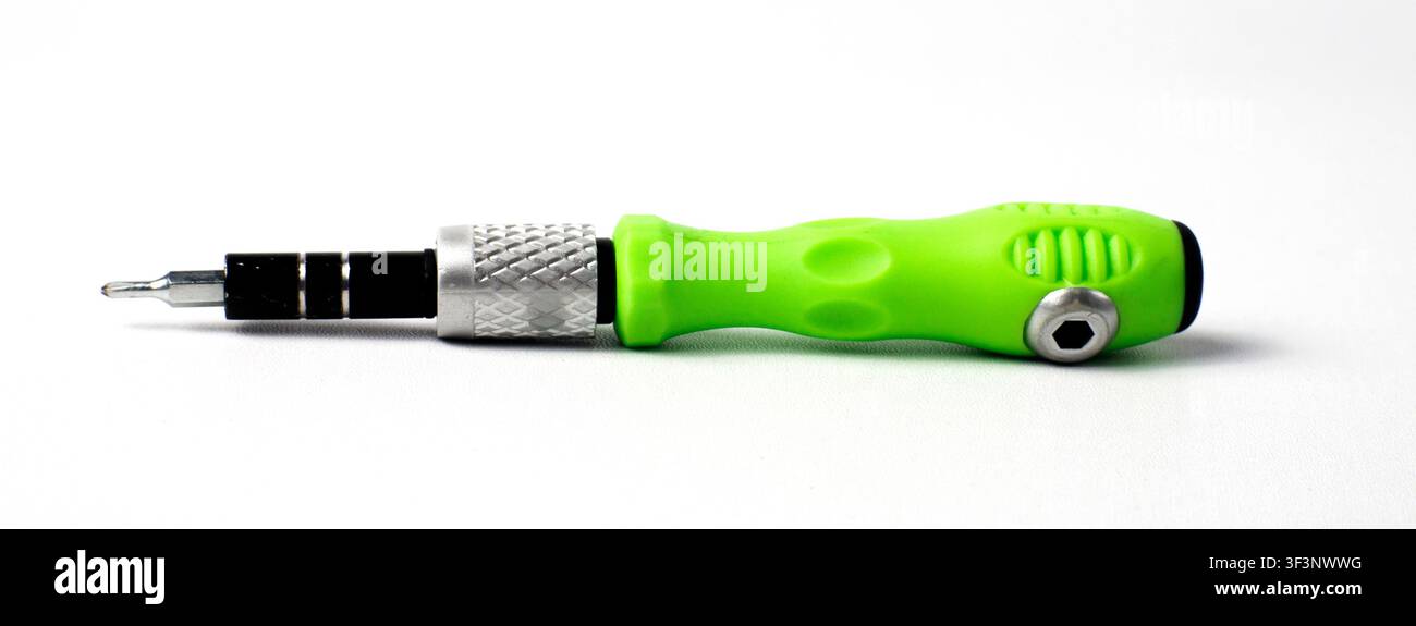 Green Screwdriver Tool Isolated on White Background Stock Photo