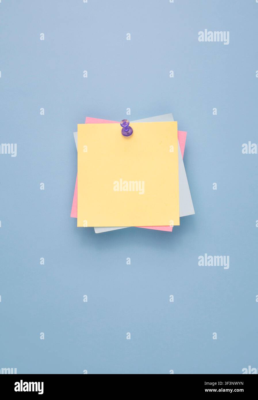Pastel Sticky Notes Pinned on Blue Background Stock Photo