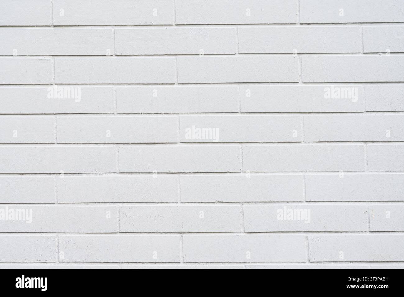 Clean white painted brick wall texture with uniform pattern. Stock Photo