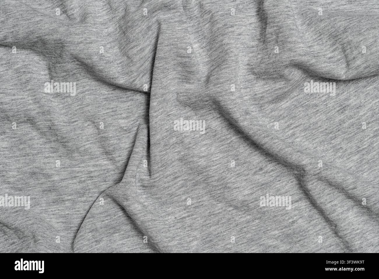Crumpled light gray heather cotton fabric texture. Stock Photo