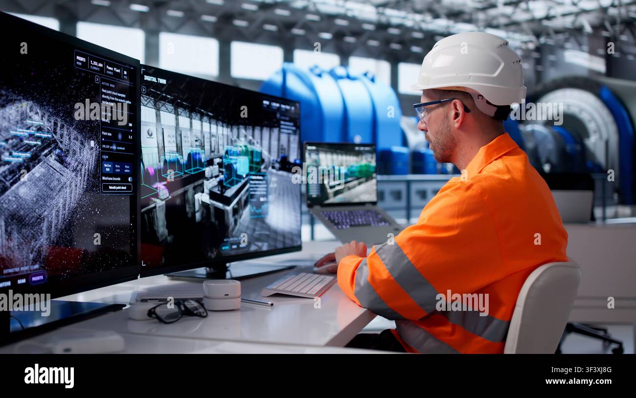 Young Engineer Monitors Real-time Industrial Data On Smart Control Room Screens. Stock Photo