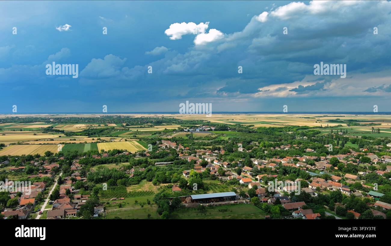 Agricultural fields under dramatic dark storm clouds Stock Photo