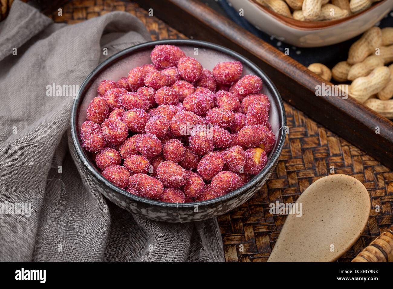 Purple coated crispy peanuts served in small plate Stock Photo