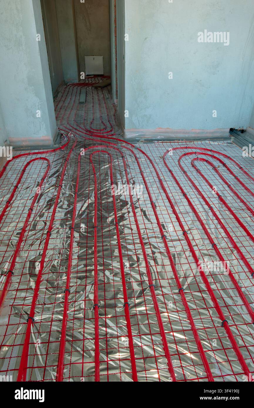 Underfloor surface heating pipes. Low temperature heating concept Stock Photo