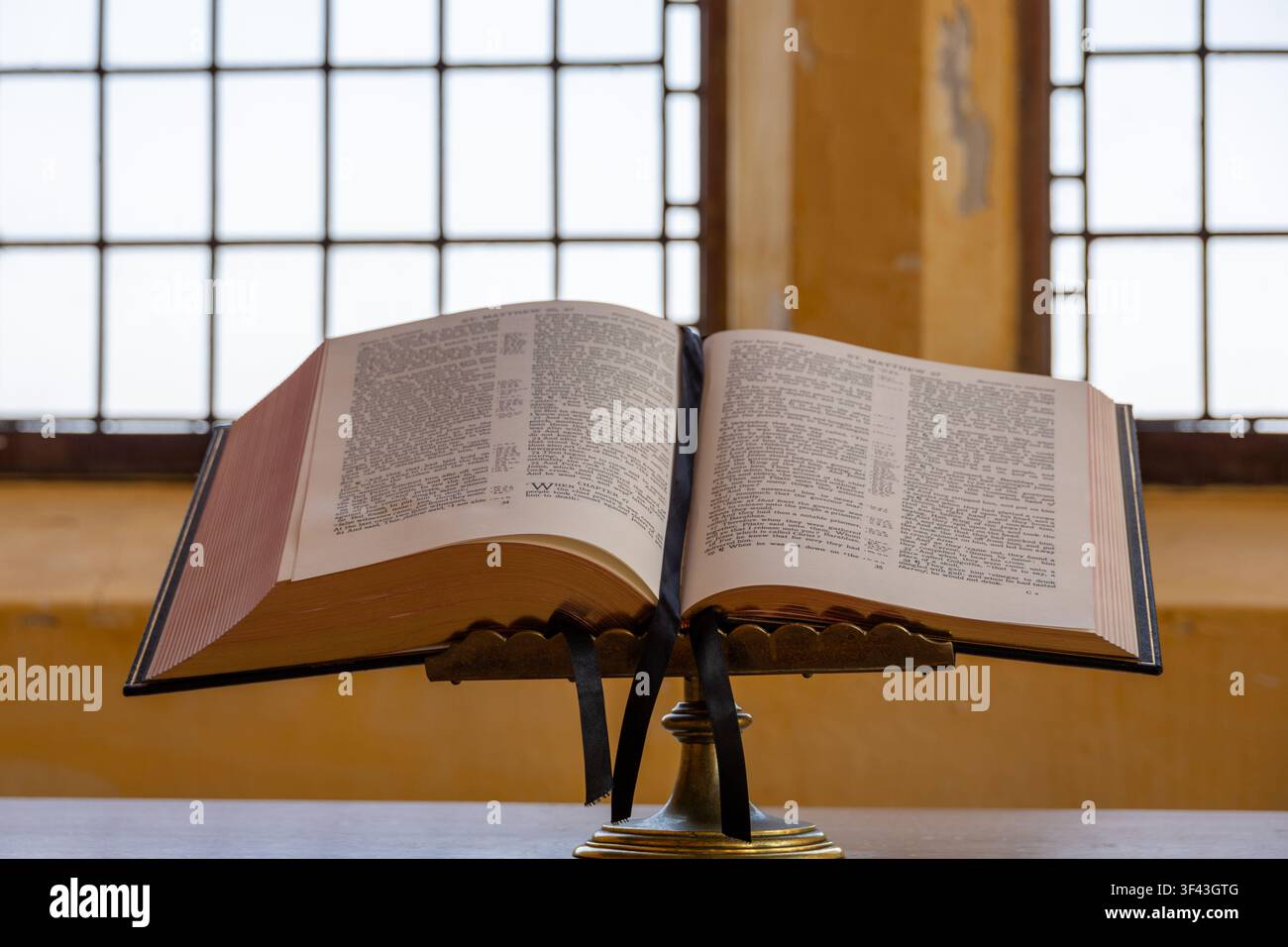 Open Bible on Altar in Historic Church Setting Stock Photo