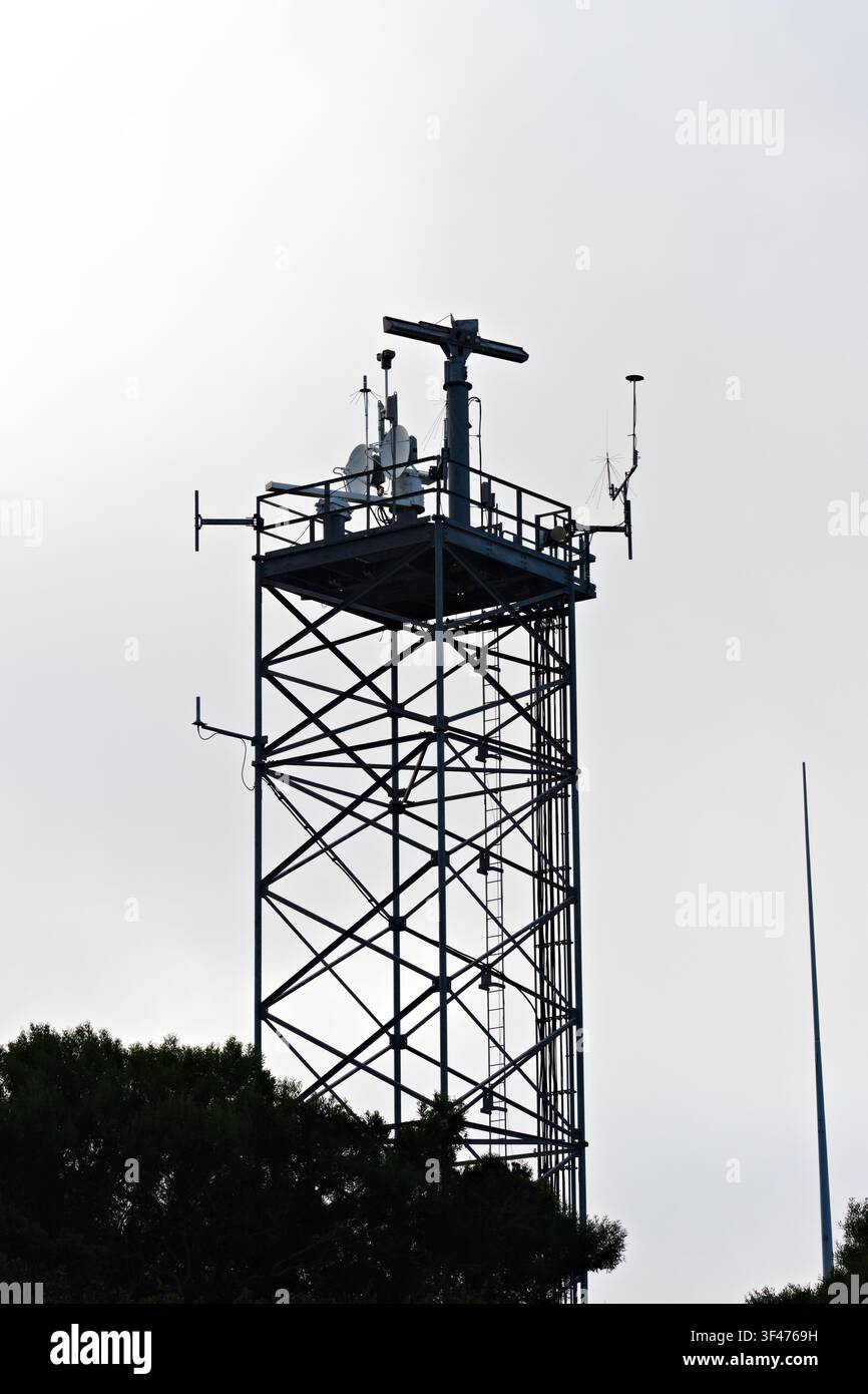 Metal communications tower with a muted sky background Stock Photo
