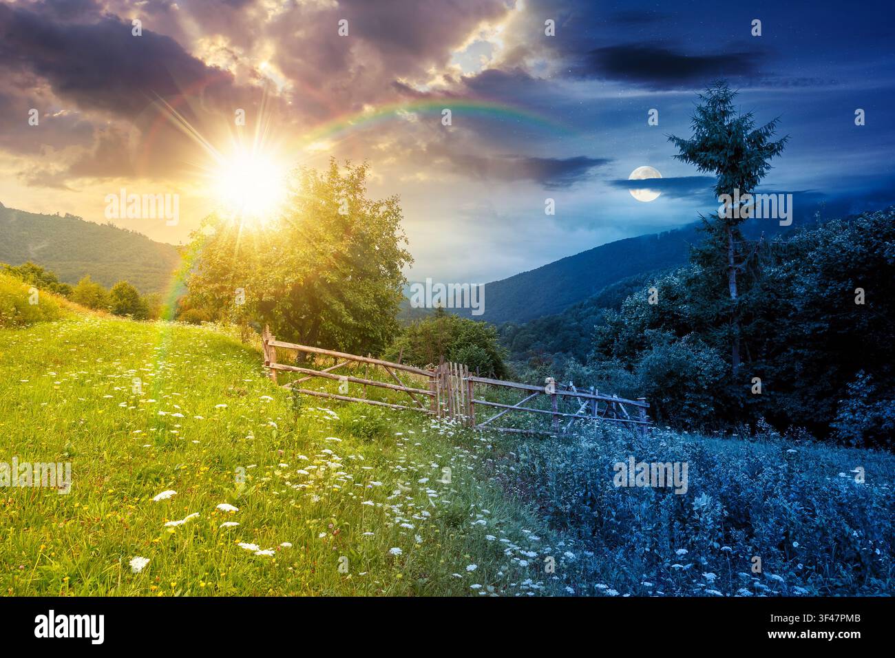 rural mountain landscape of ukraine at twilight. countryside scenery of transcarpathia in summer. night meet day concept. forested hills and grassy me Stock Photo