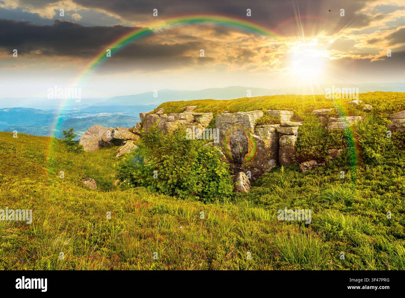 sunset over alpine meadow in summer nature. wild grass and grey rocks in carpathian landscape. mountain scenery of perechyn district, ukraine. weather Stock Photo