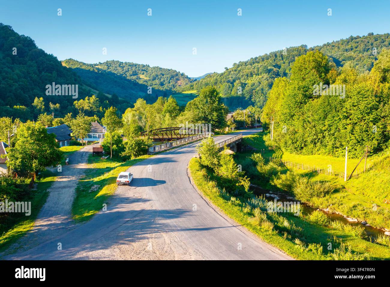 countryside road through carpathian mountains. beautiful summer landscape for ukraine travel background Stock Photo