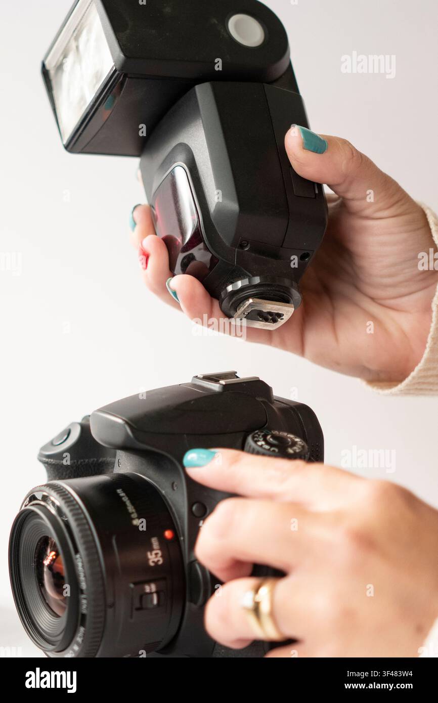 Installing an External Flash onto DSLR Camera; Vertical Image Stock Photo