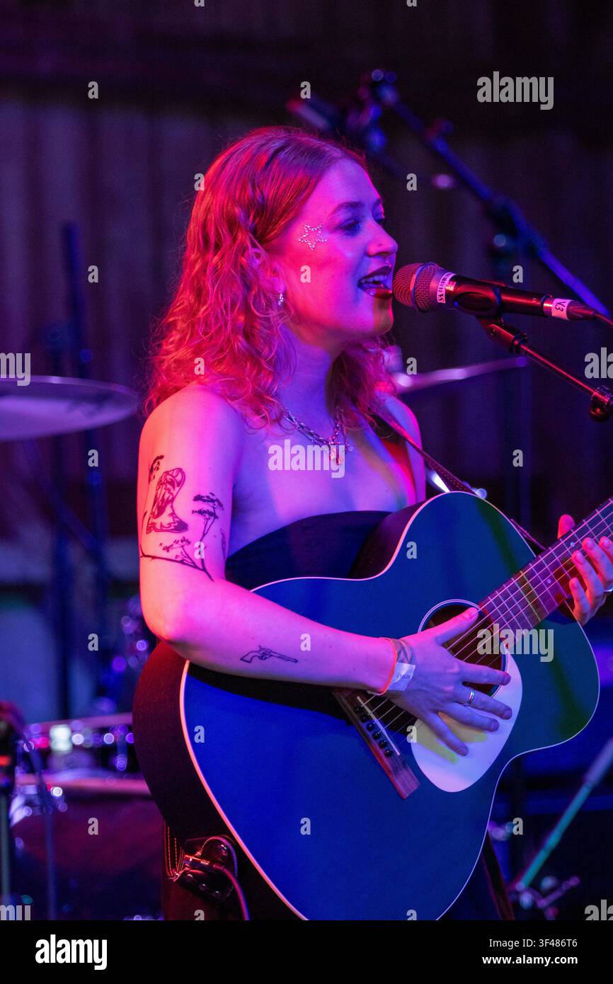 Singer songwriter Ella Spencer on the Barn stage at the 19th Maverick long weekend Americana music festival held in Easton Farm Park in rural Suffolk. Stock Photo