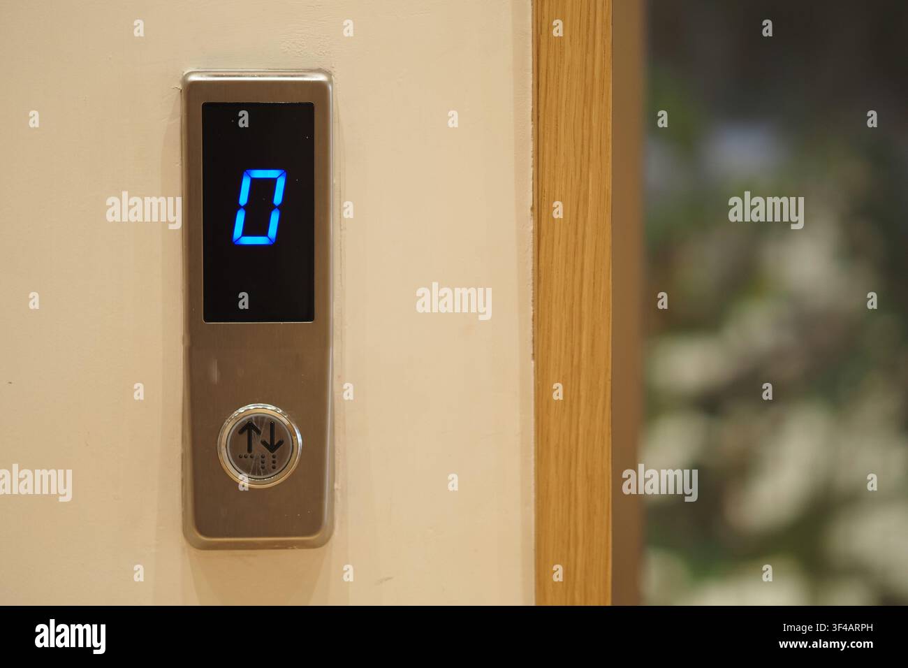 Elevator button showing the current floor number zero Stock Photo