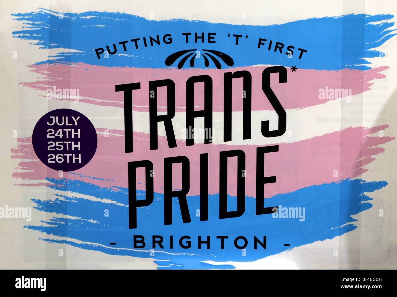 Historic Trans Pride Brighton poster for July 2015, using pink, blue and white graphics and the slogan Putting the T First - LGBTQ+ Stock Photo