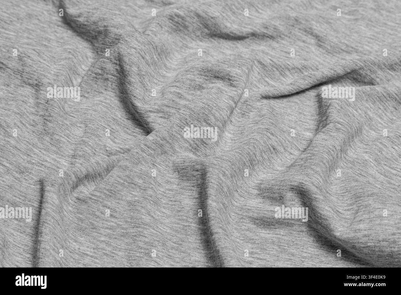 Crumpled light gray heather cotton fabric texture. Stock Photo