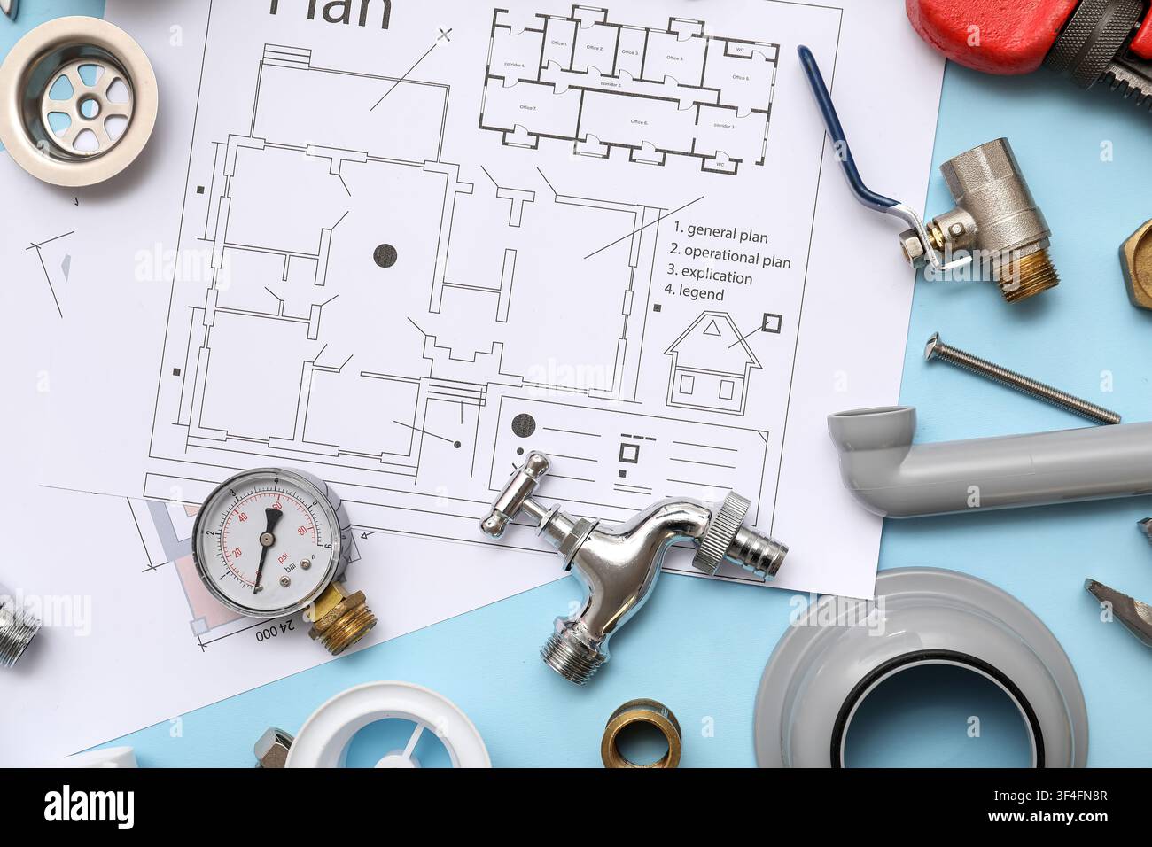 Composition with plumbers items and house plans on blue background Stock Photo