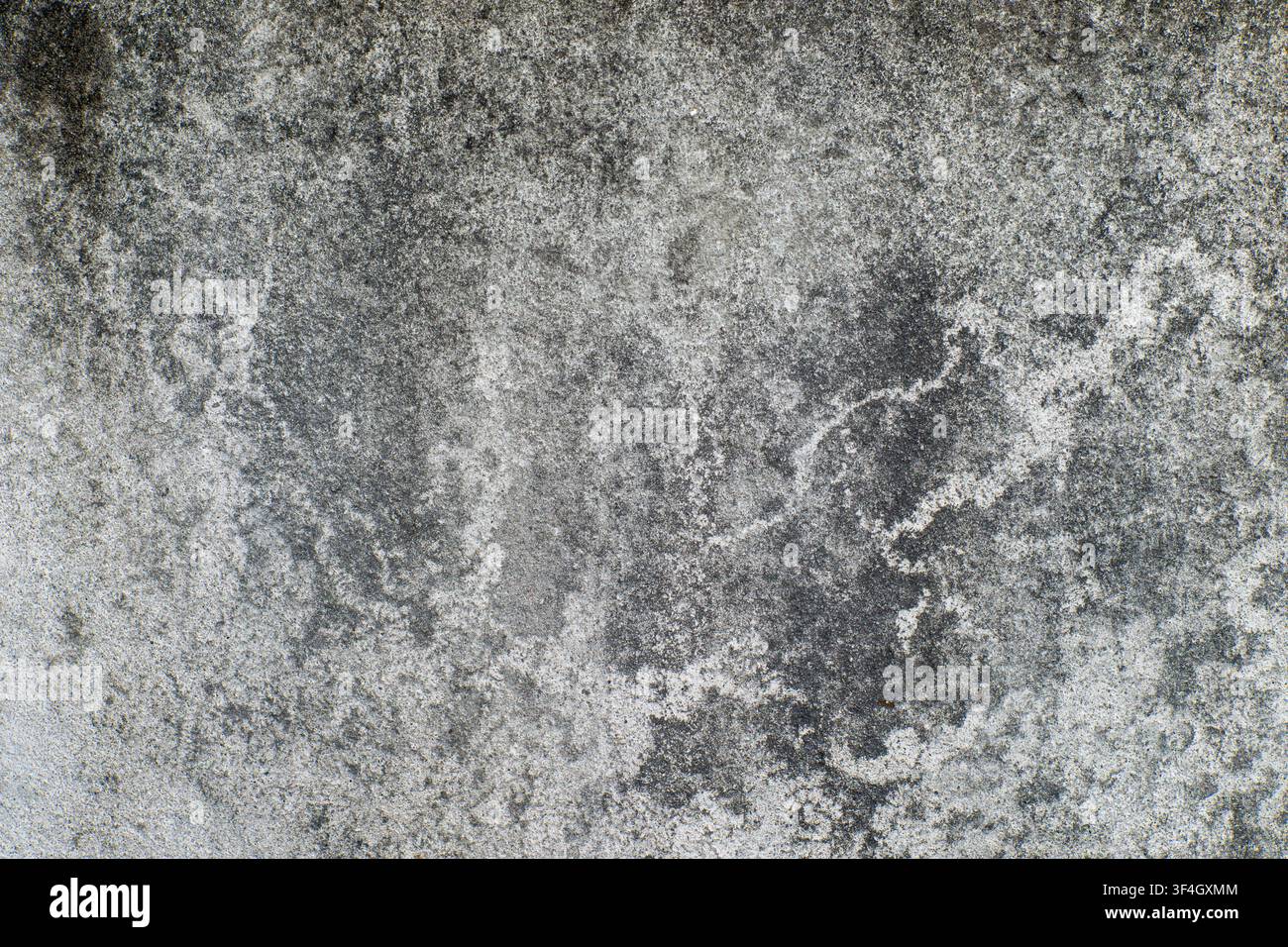 Weathered concrete wall texture featuring dark grunge patterns and rough surface details. Background overlay, digital design element Stock Photo