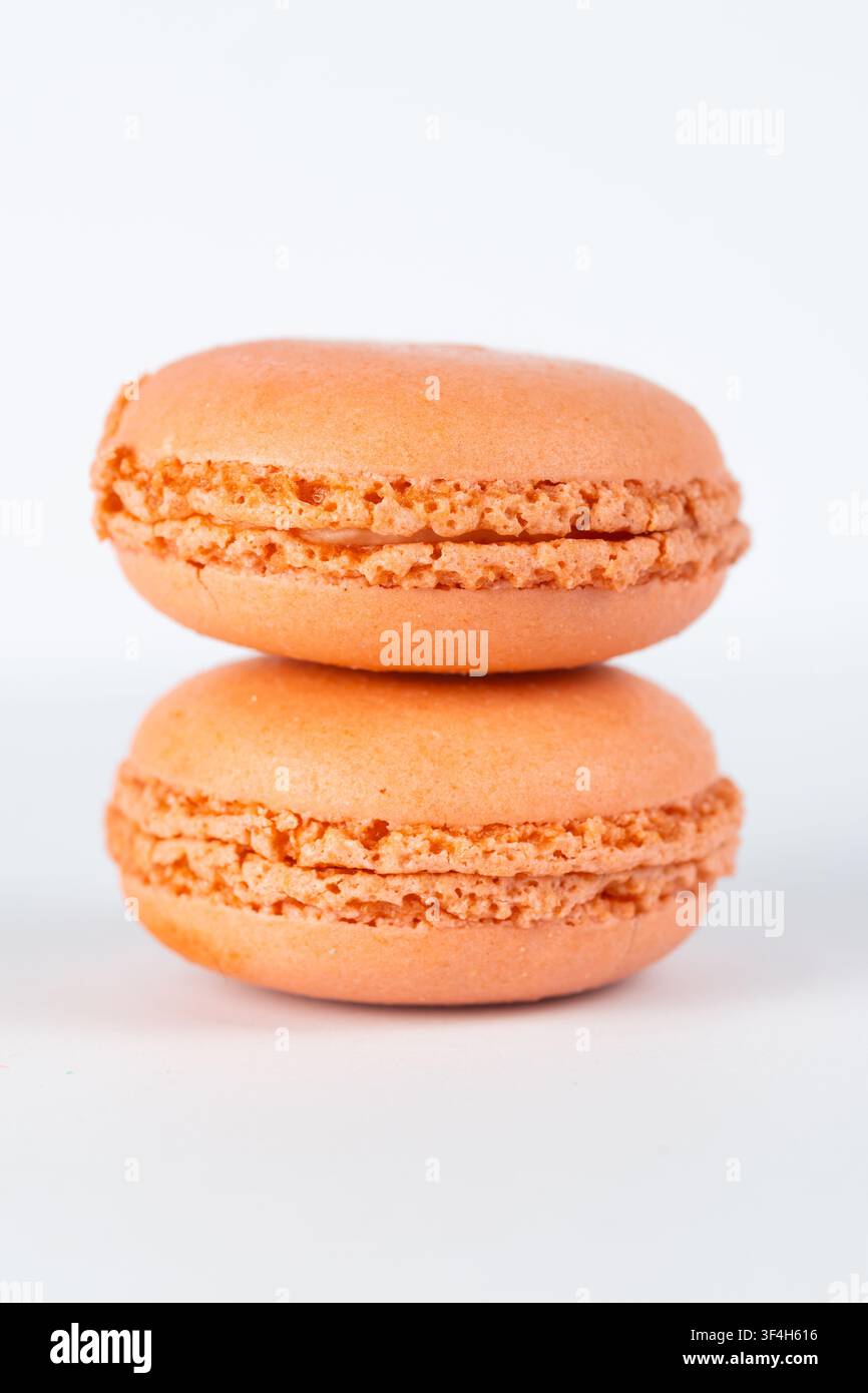 Orange Macarons Isolated on White Background Stock Photo