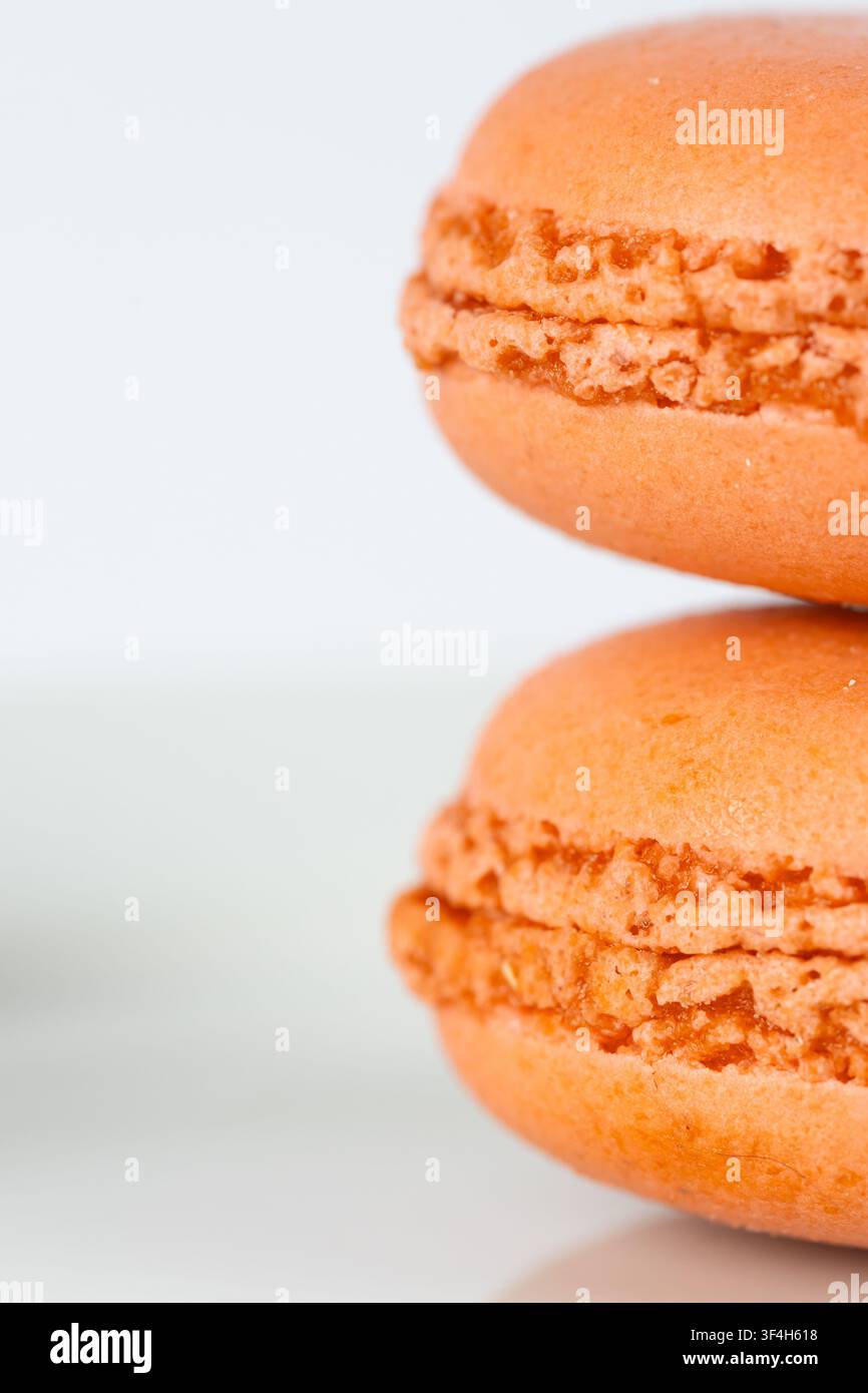 Orange Macarons Isolated on White Background Stock Photo
