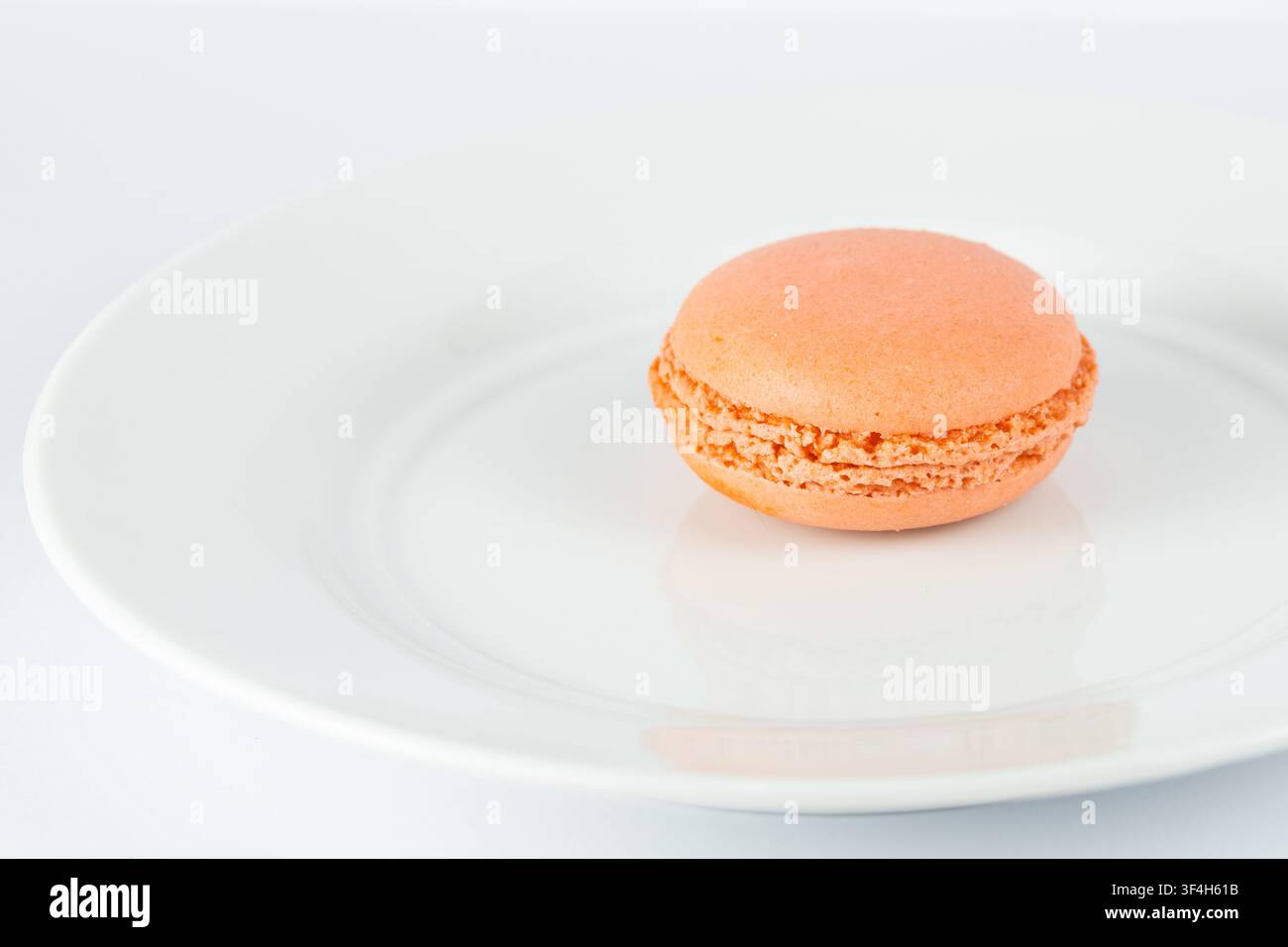 Orange Macarons Isolated on White Background Stock Photo