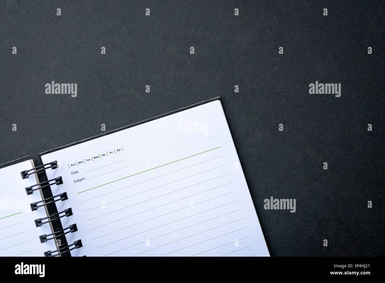 Open notepad on top of dark background. Copy space. Stock Photo