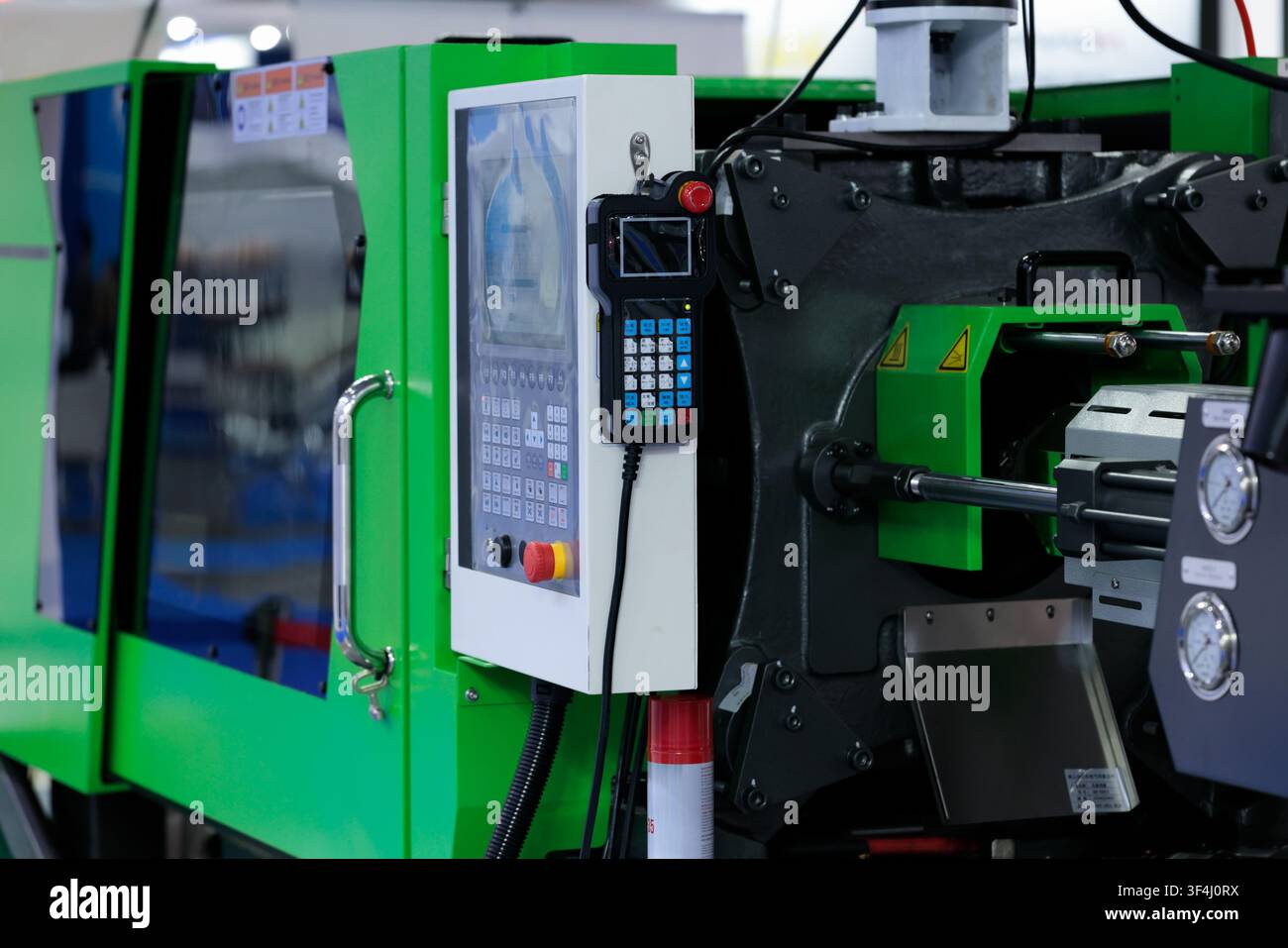 Automatic plastic injection molding machine close up. Selective focus. Stock Photo