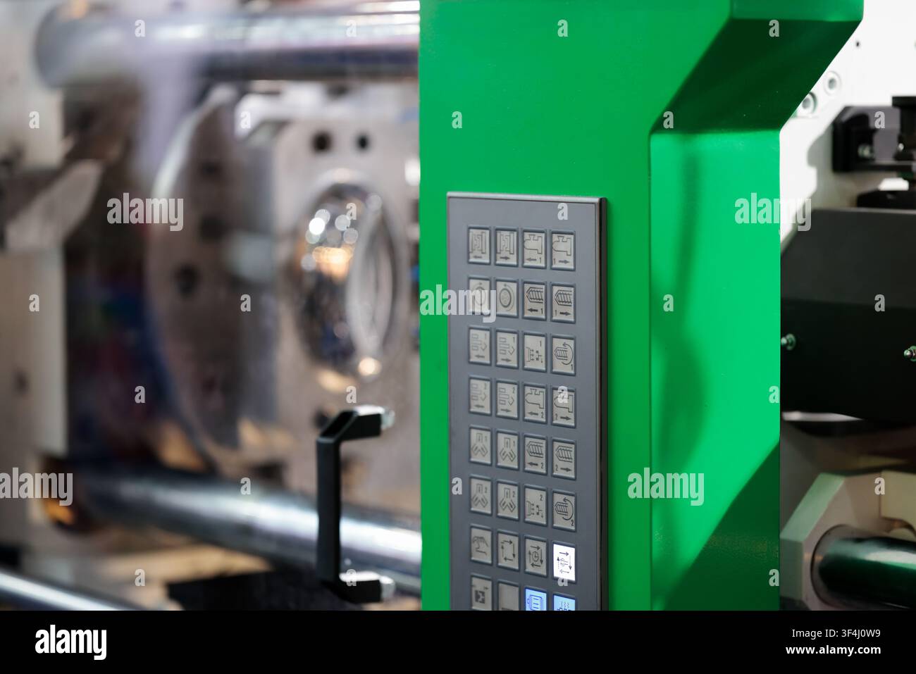 Close up of buttons on plastic molding machine control panel. Selective focus. Stock Photo
