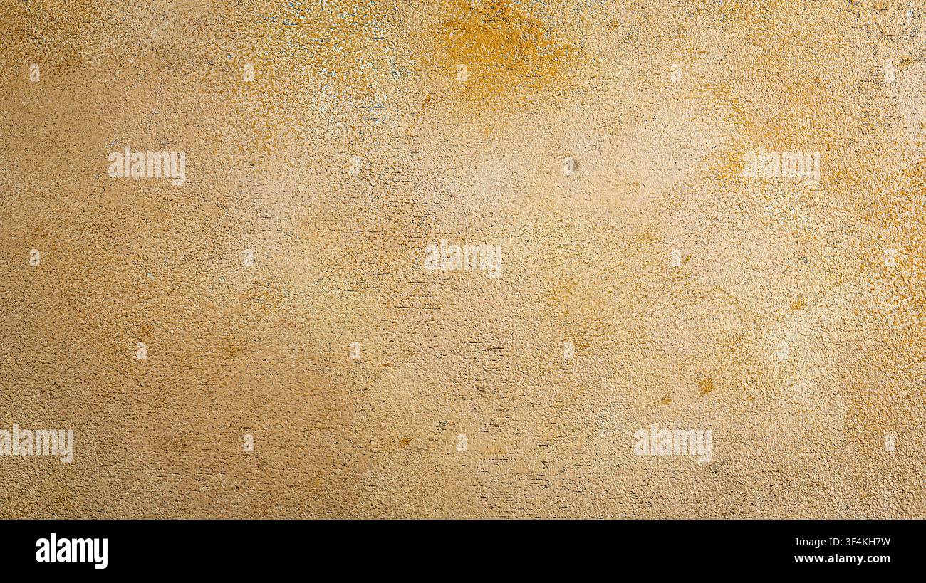 Abstract light golden beige cement wall texture background with subtle grainy texture Stock Photo