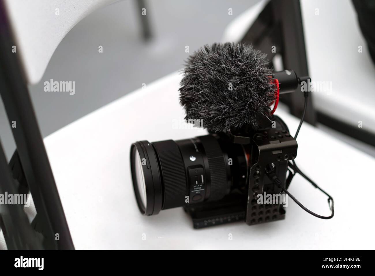 Mirrorless Camera with External Microphone for Video Production Stock Photo