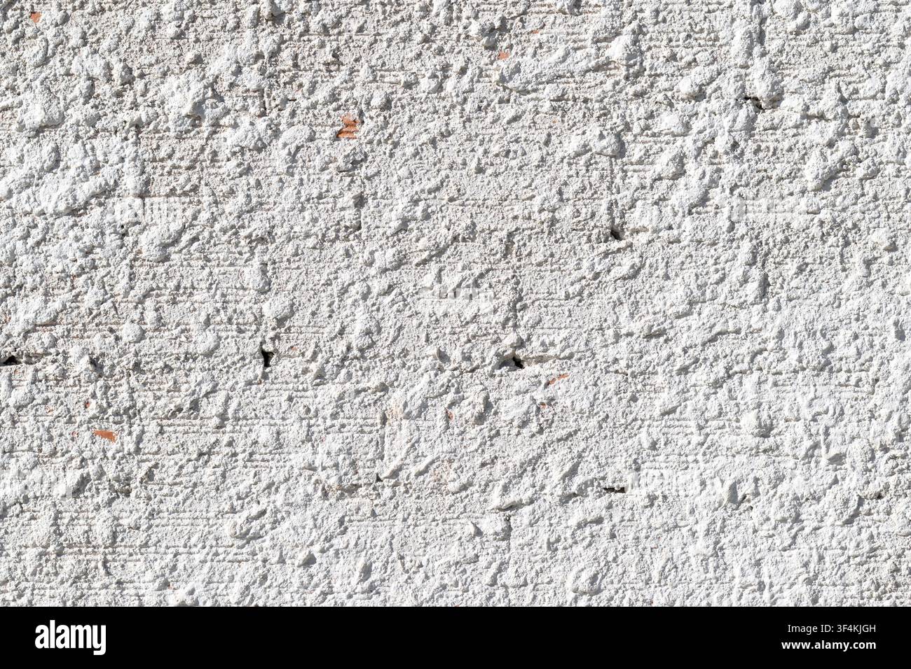 background texture of a white rough wall with coarse mortar plaster surface Stock Photo