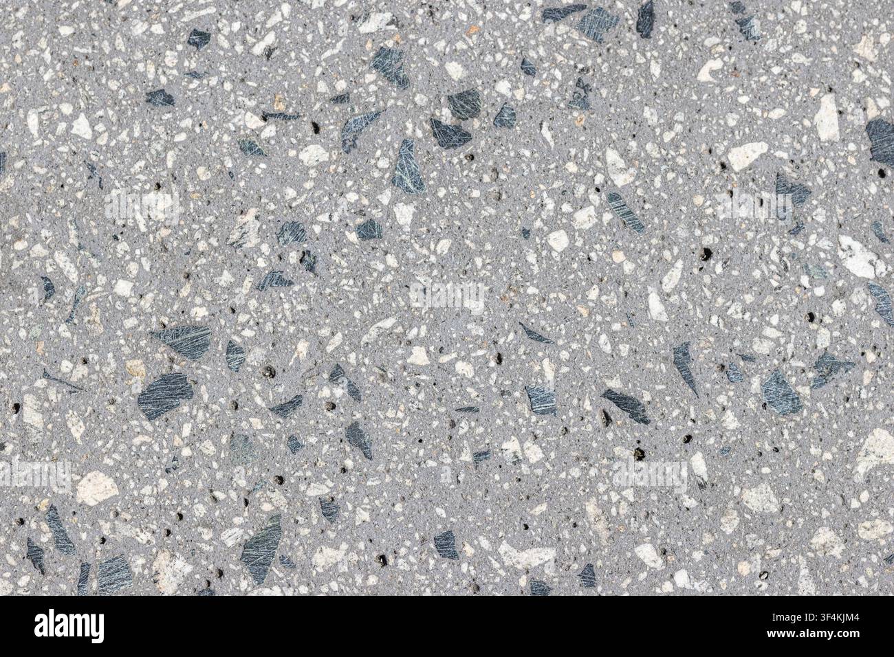 Abstract background of a polished aggregate concrete. Full frame Stock Photo