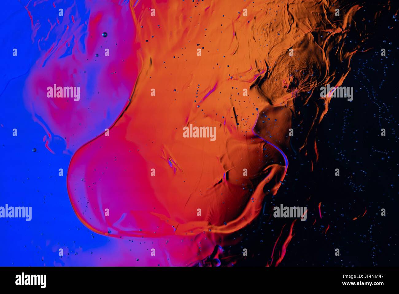 Fluid texture creating dynamic motion and contrasting colors in a macro composition Stock Photo
