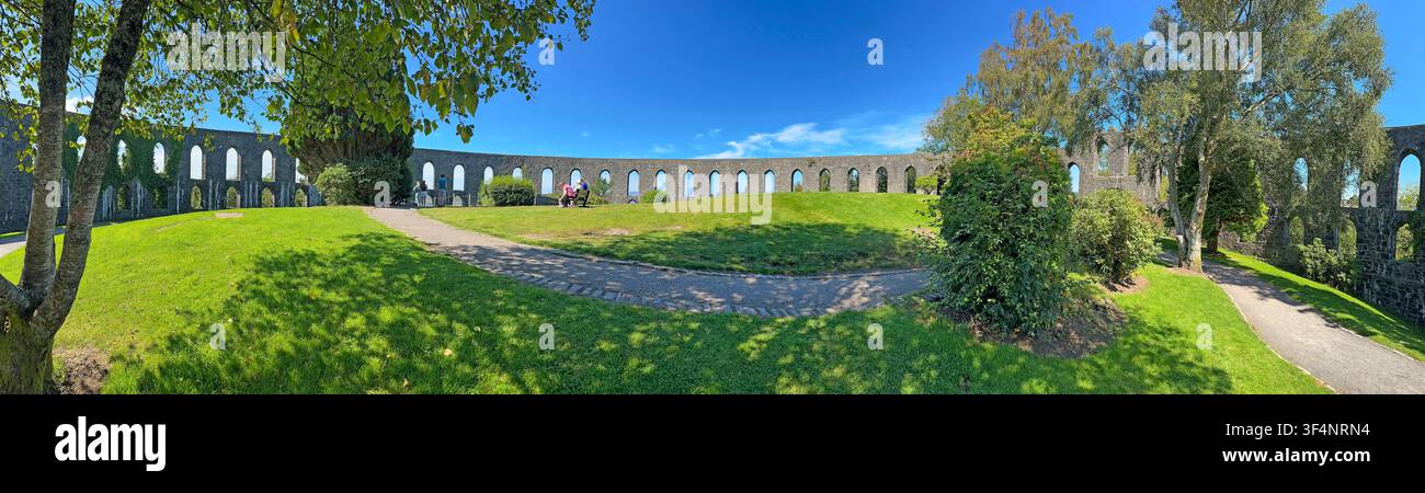 Panoramic view of McCaig’s Tower, also known as McCaig’s Folly, the distinctive stone landmark overlooking Oban,Argyll and Bute,Scotland, on sunny day Stock Photo