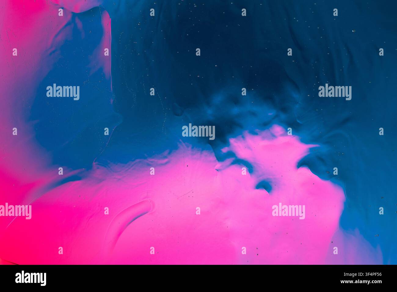 Abstract blue and pink fluid creating an active texture and gradient background Stock Photo