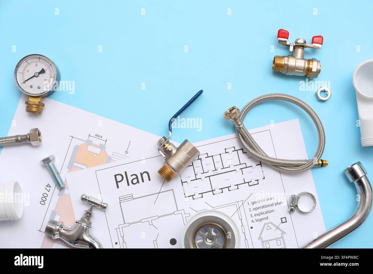 Composition with plumbers items and house plans on blue background Stock Photo