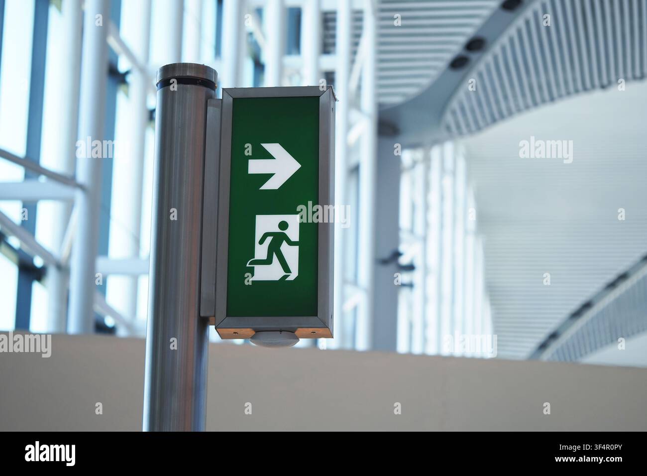 Sign showing exit path in a public building Stock Photo