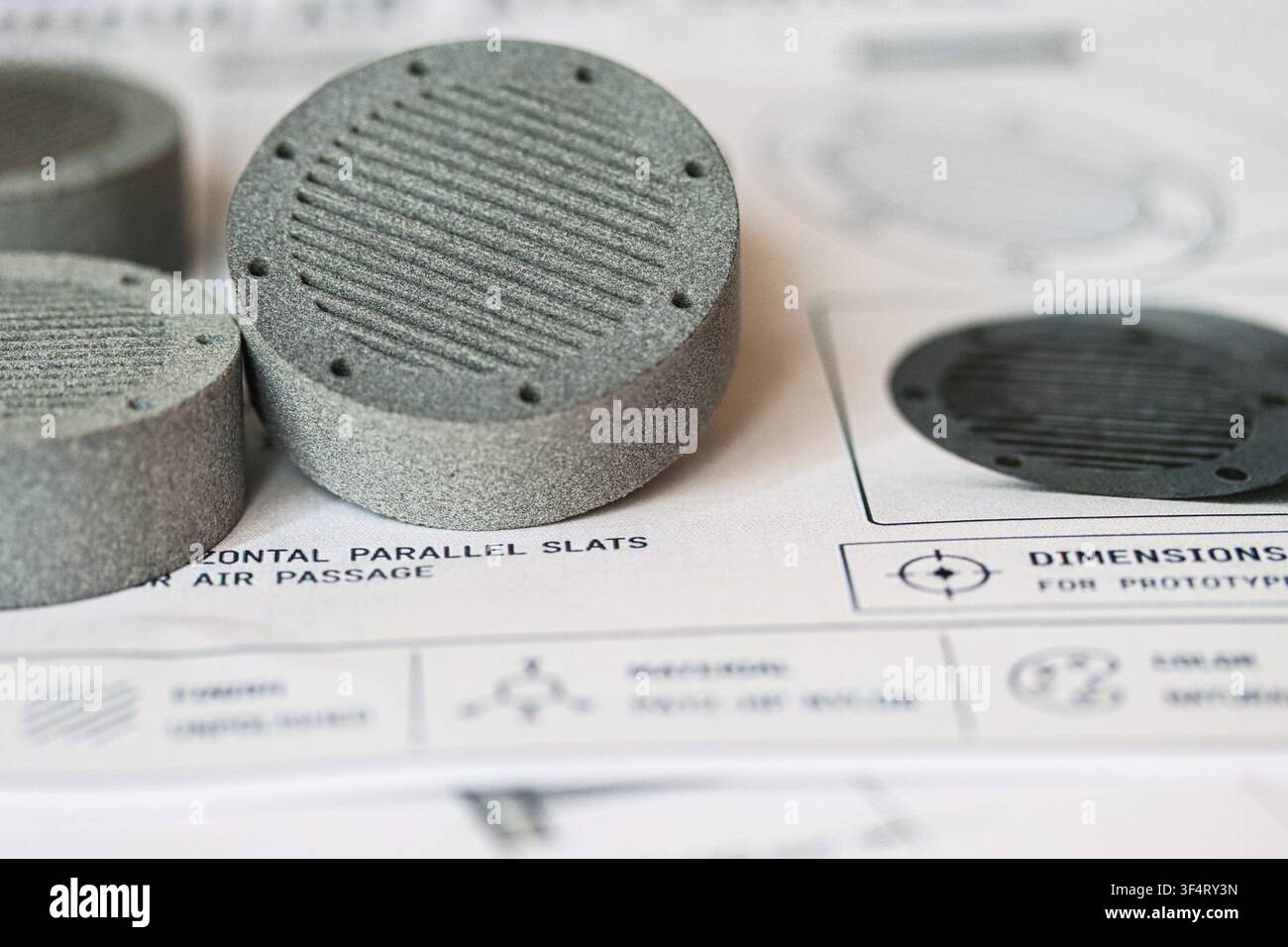 MJF 3D printed parts with ridged pattern on technical blueprint background Stock Photo