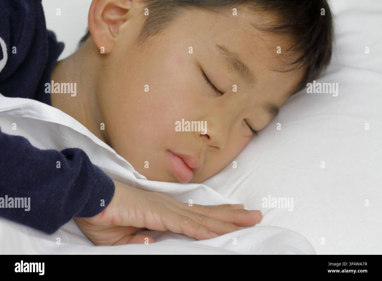 sleeping Japanese boy (third grade at elementary school) Stock Photo