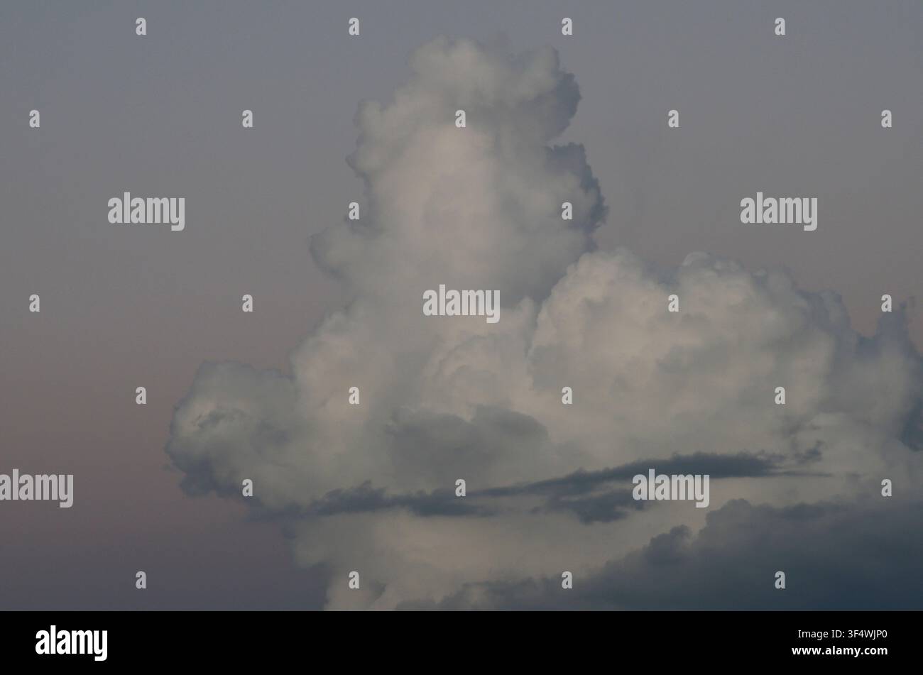 Cumulus Clouds just after sunset Stock Photo