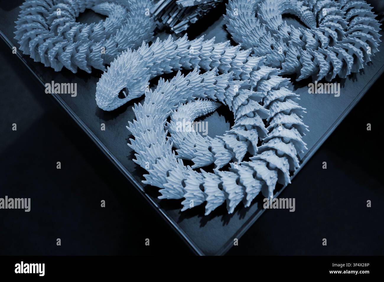 Art models printed on 3D printer. Different objects created on 3D printer from molten plastic. 3D printed different objects. Modern new modern additive progressive technologies. 3D printing technology Stock Photo