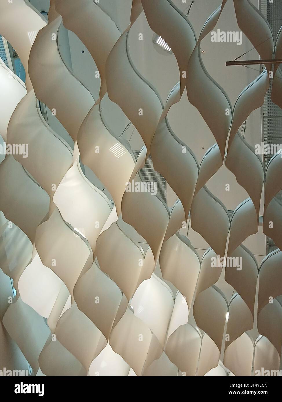 Abstract architectural background featuring a white geometric grid structure with cell pattern and shadow lines Stock Photo