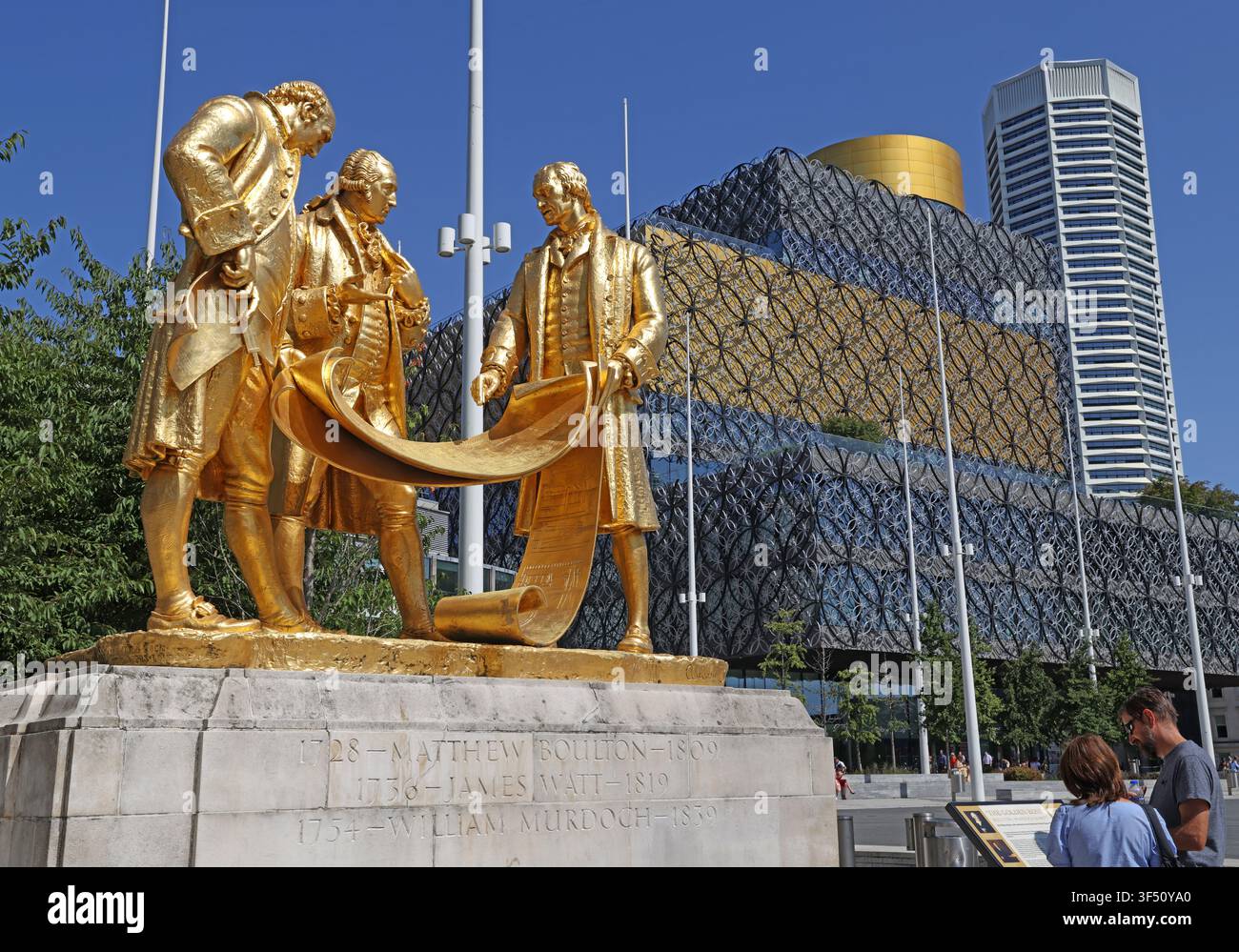 The Birmingham golden boys statue, in front of central library, centenary square, Matthew Boulton, James Watt & William Murdoch by William Bloye Stock Photo