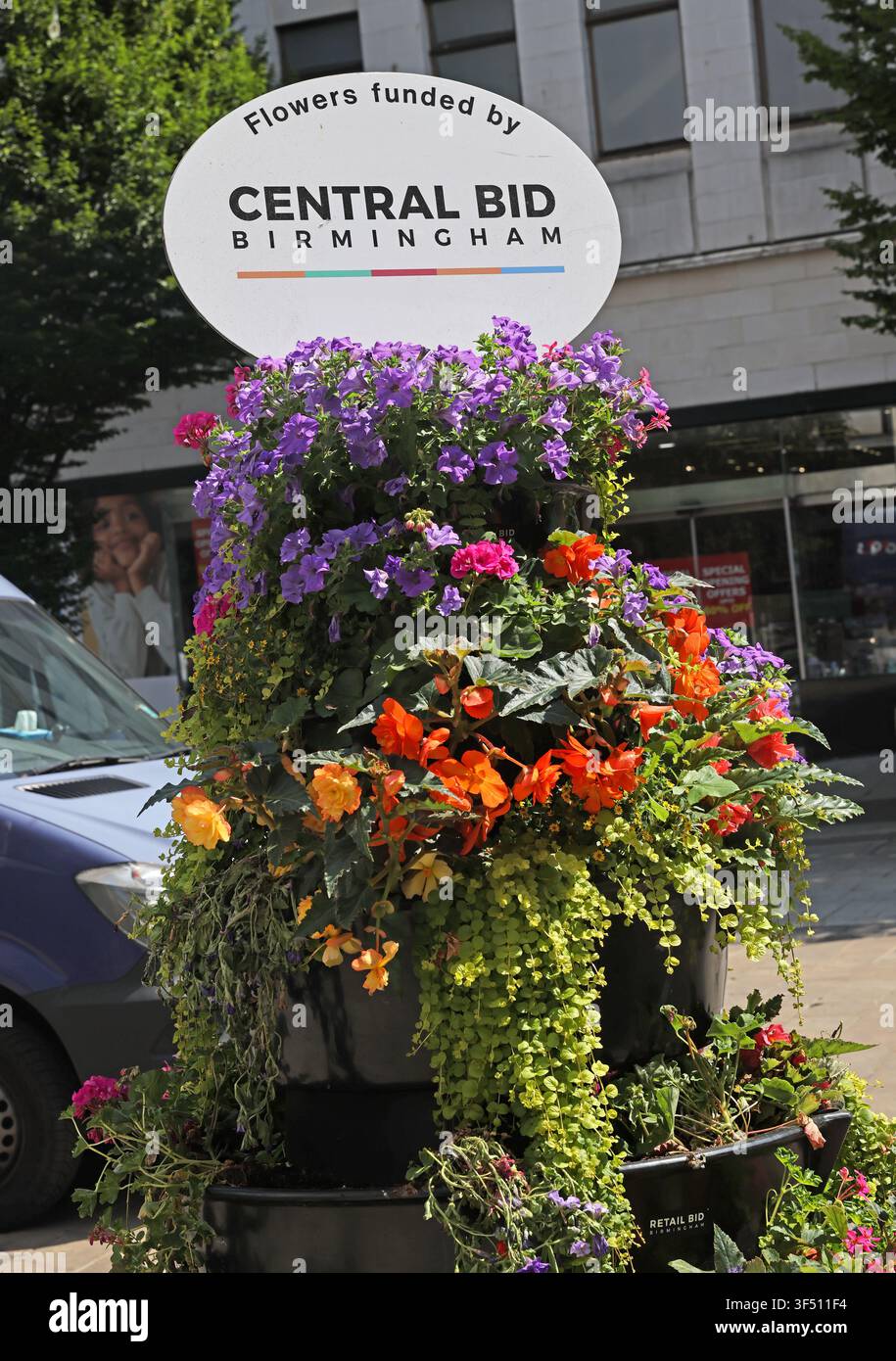 Colourful Central BID hanging flower display in Birmingham city centre, West Midlands, England, UK. Stock Photo