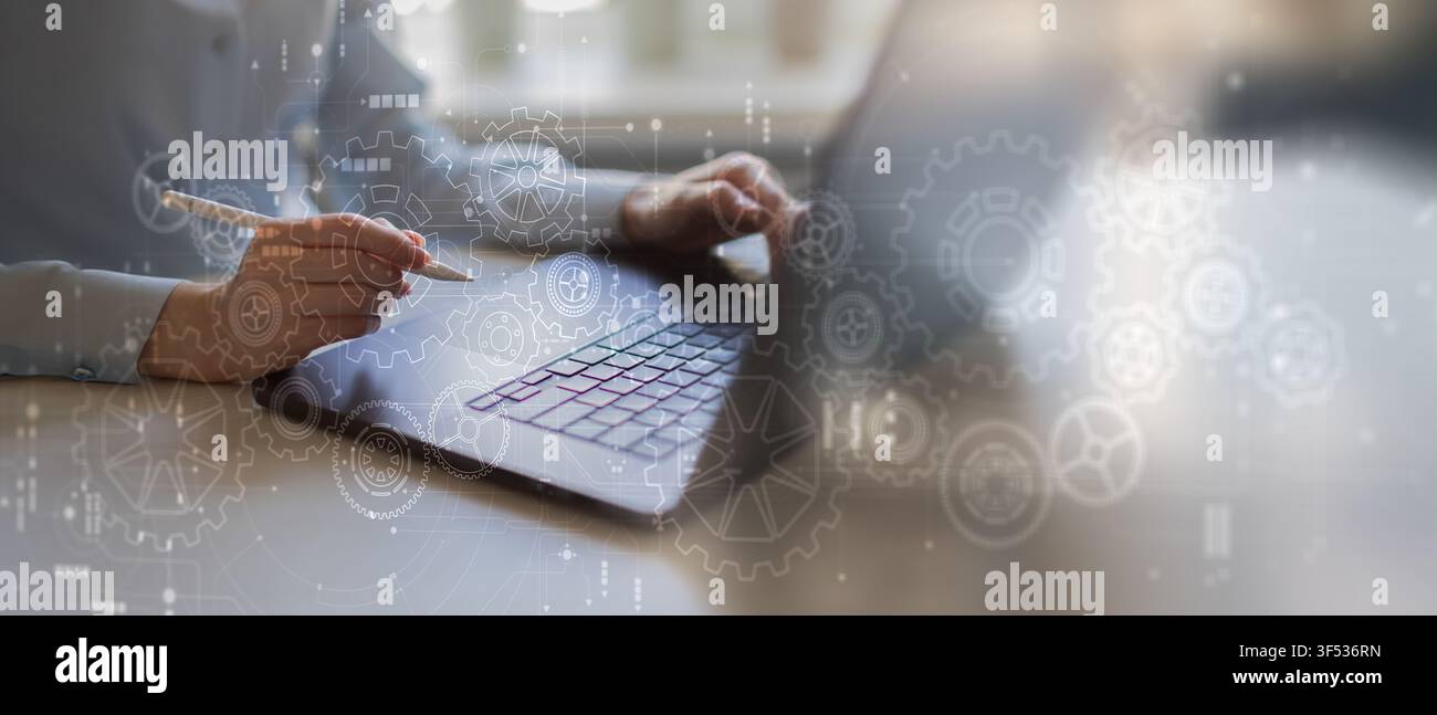 Robotic Process Automation system for business workflow optimization with hand interaction on laptop Stock Photo