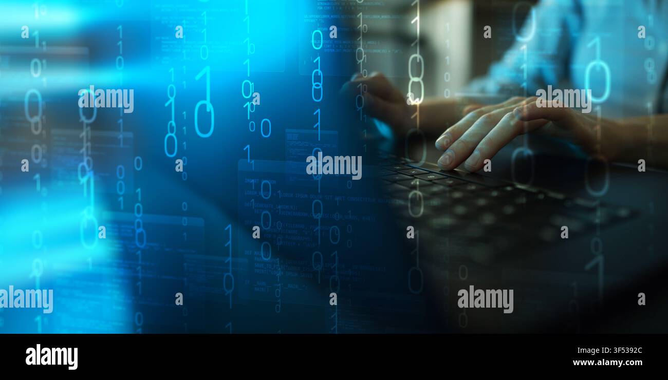 Software programming concept for IT development with hands typing on a keyboard and digital binary code Stock Photo